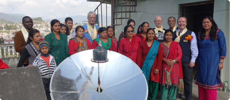 SCI and local partners discussing solar cooking solutions