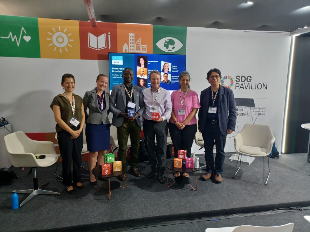 Speakers sharing solar cooking innovations during a COP30 side event