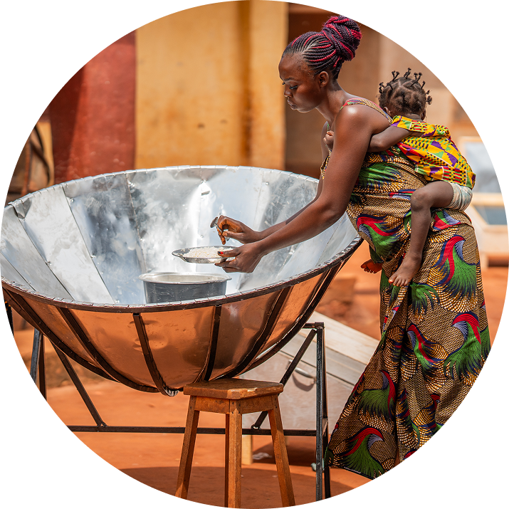 Community members learning to use a solar cooker in the Central African Republic