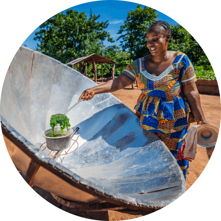 Community members learning solar cooking through hands-on training and local partnerships