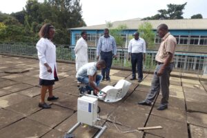 SCI researcher measuring solar cooker performance during a Solar Cooker Performance Evaluation Process test
