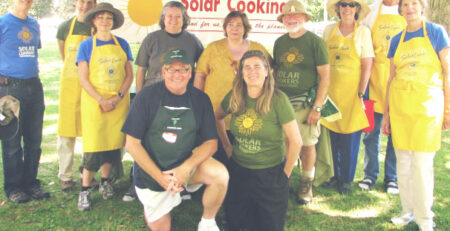 Doran Smout demonstrating solar cooking as a dedicated Solar Cookers International volunteer and supporter