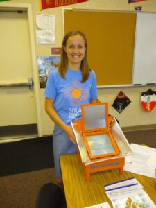 SCI Executive Director Caitlyn Hughes presenting solar cooking solutions to Sacramento students