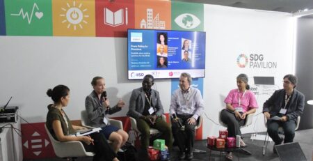 SCI representatives speaking at the COP30 SDG Pavilion on scalable solar cooking solutions