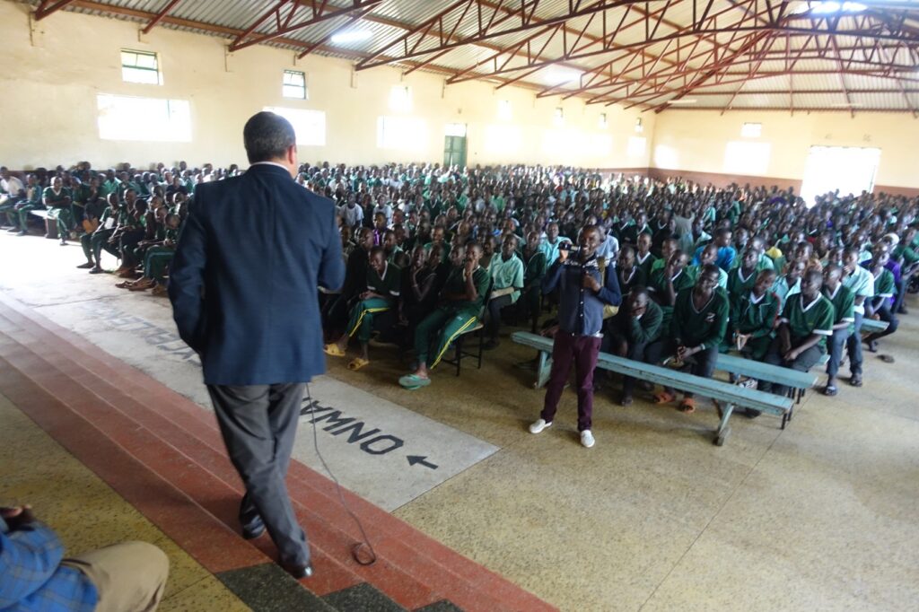 Students in Kenya learning about solar cooking benefits during Solar Cookers International education program