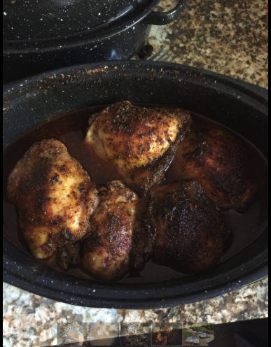 Solar cooker with homemade baked chicken and vegetables prepared by SCI supporter Maria