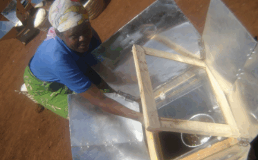 Solar cooker demonstrating clean cooking as a climate solution to reduce carbon emissions