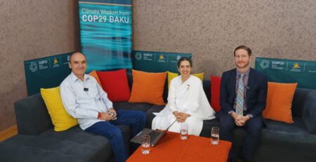 Golo Pilz, Maureen Goodman, and Keith Wingeard speaking at the Climate Wisdom COP29 event in Baku, Azerbaijan