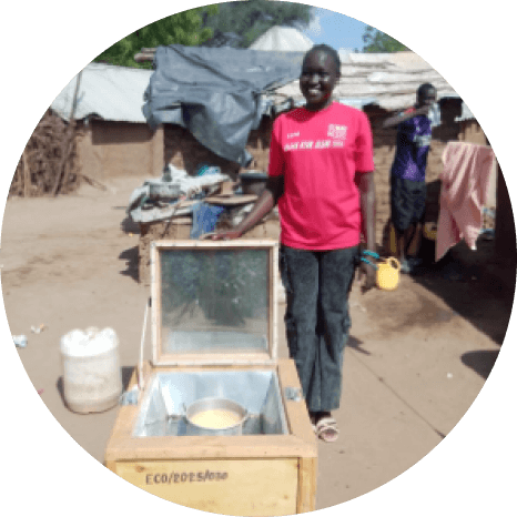 Person using a solar cooker instead of firewood for cooking