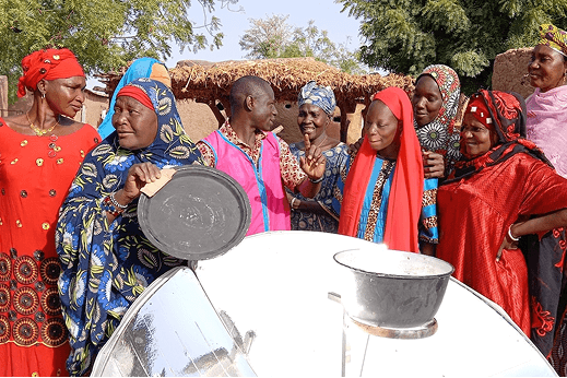 Participants learning to use solar cookers during a training session in Mali